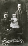 Studio portrait of a couple with a baby girl