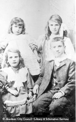 Studio portrait of four young children