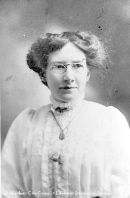 Studio portrait of a lady wearing spectacles