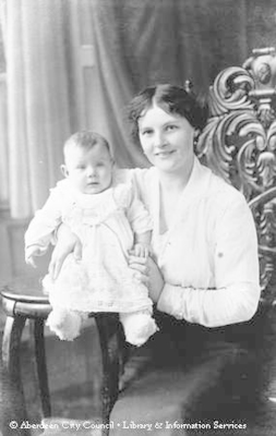 Studio portrait of mother with young baby