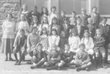 Class photograph of  schoolchildren and teacher