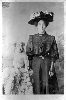Studio portrait of a lady with a dog