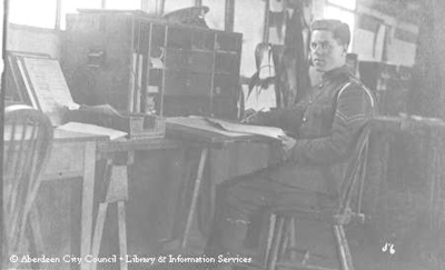 Portrait of young soldier at desk